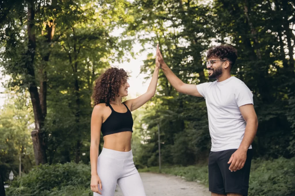 happy multi ethnic couple giving high five after e utc